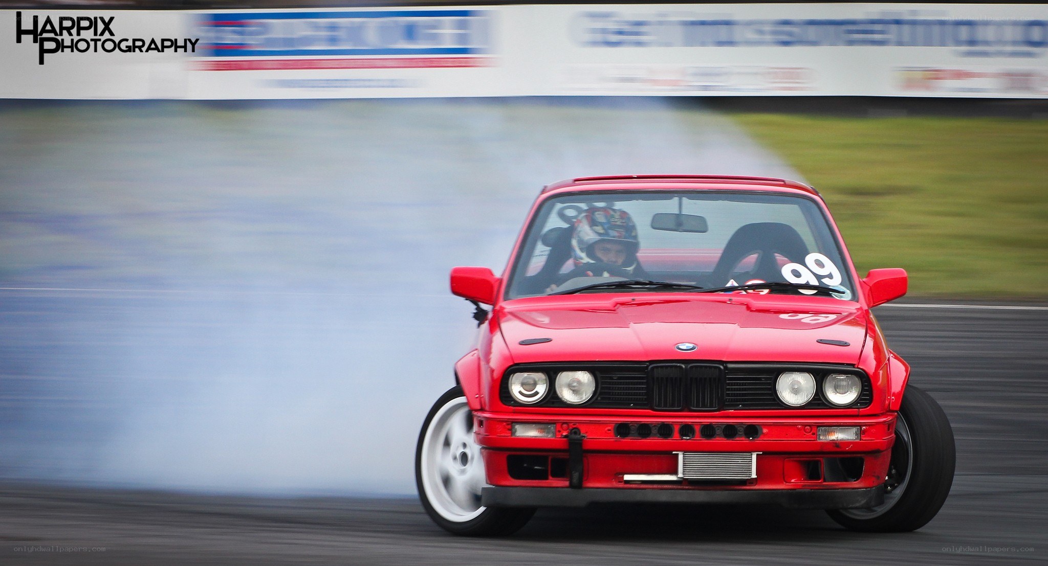 Red BMW drifting on track