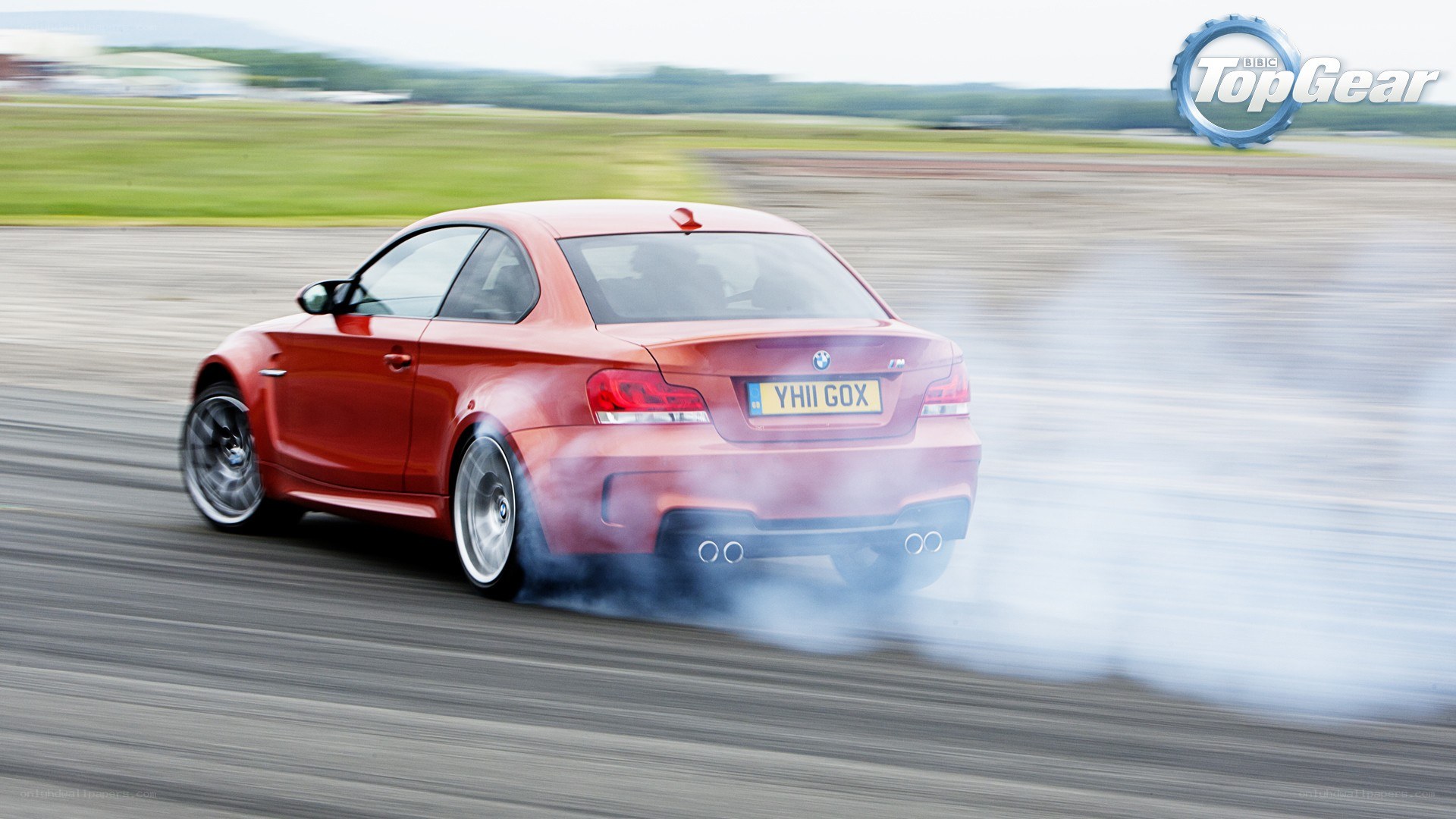 Red BMW drifting on track
