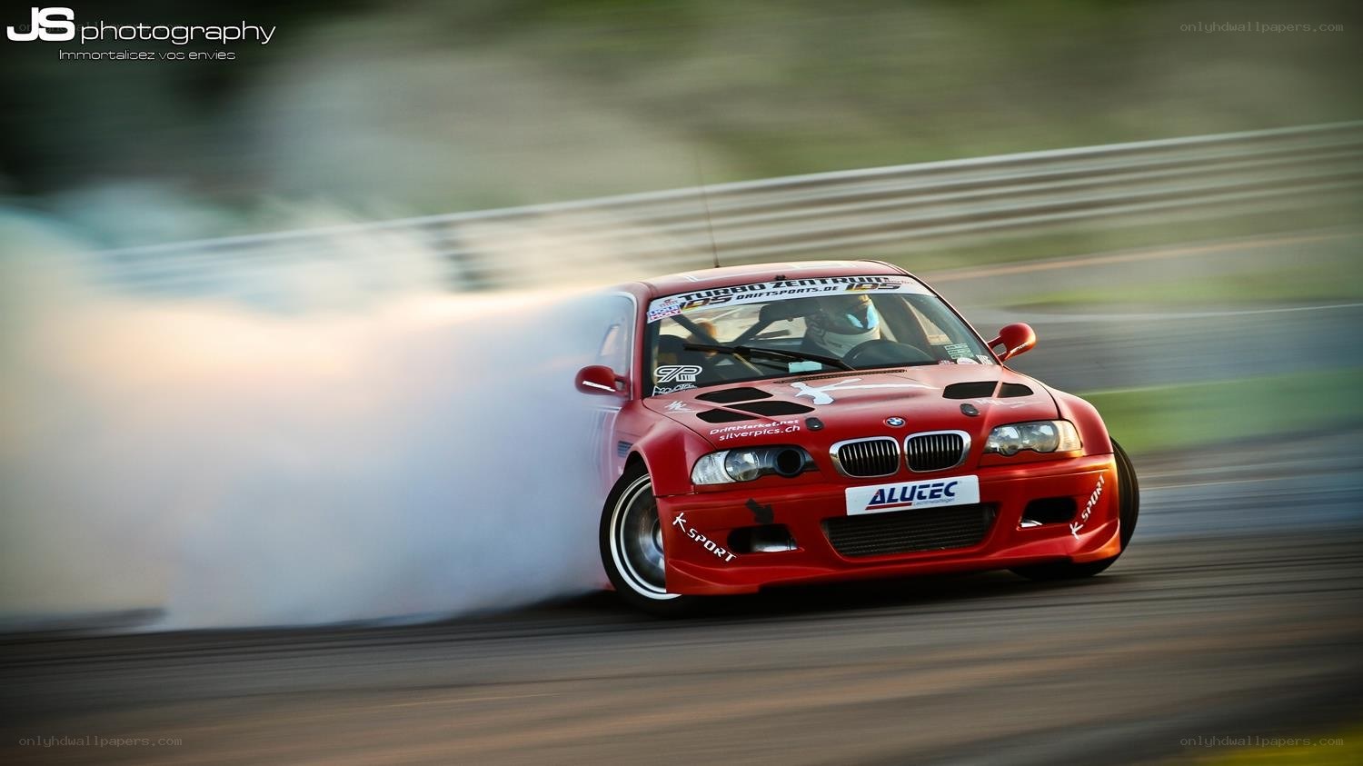 Red BMW drifting on track