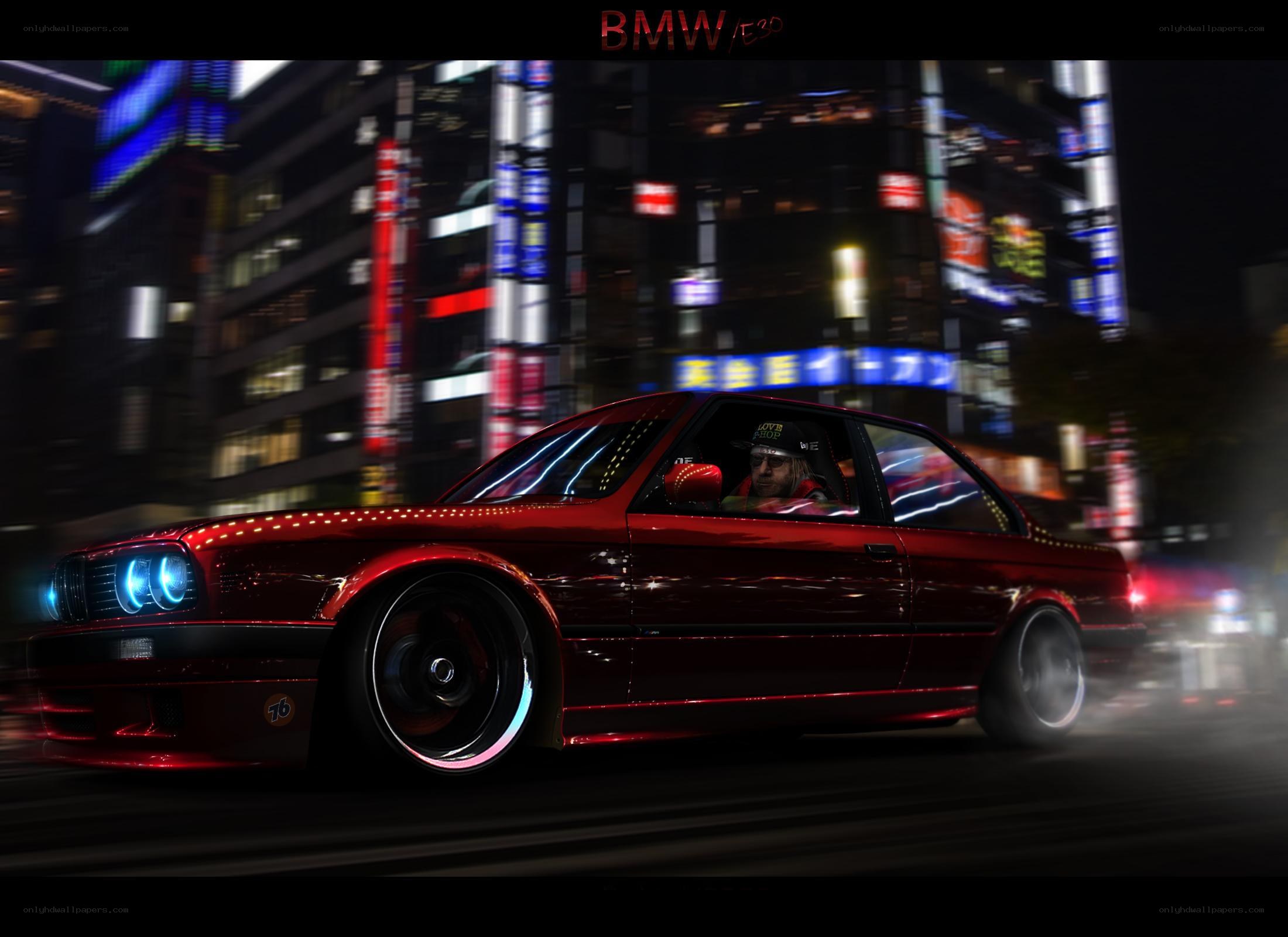 Red BMW drifts at night