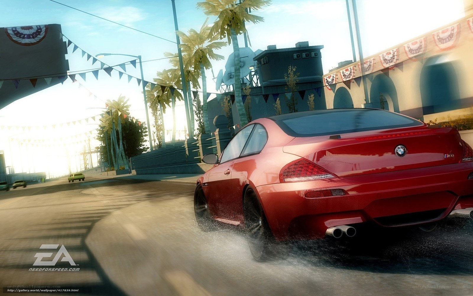 Red BMW drifts on wet road