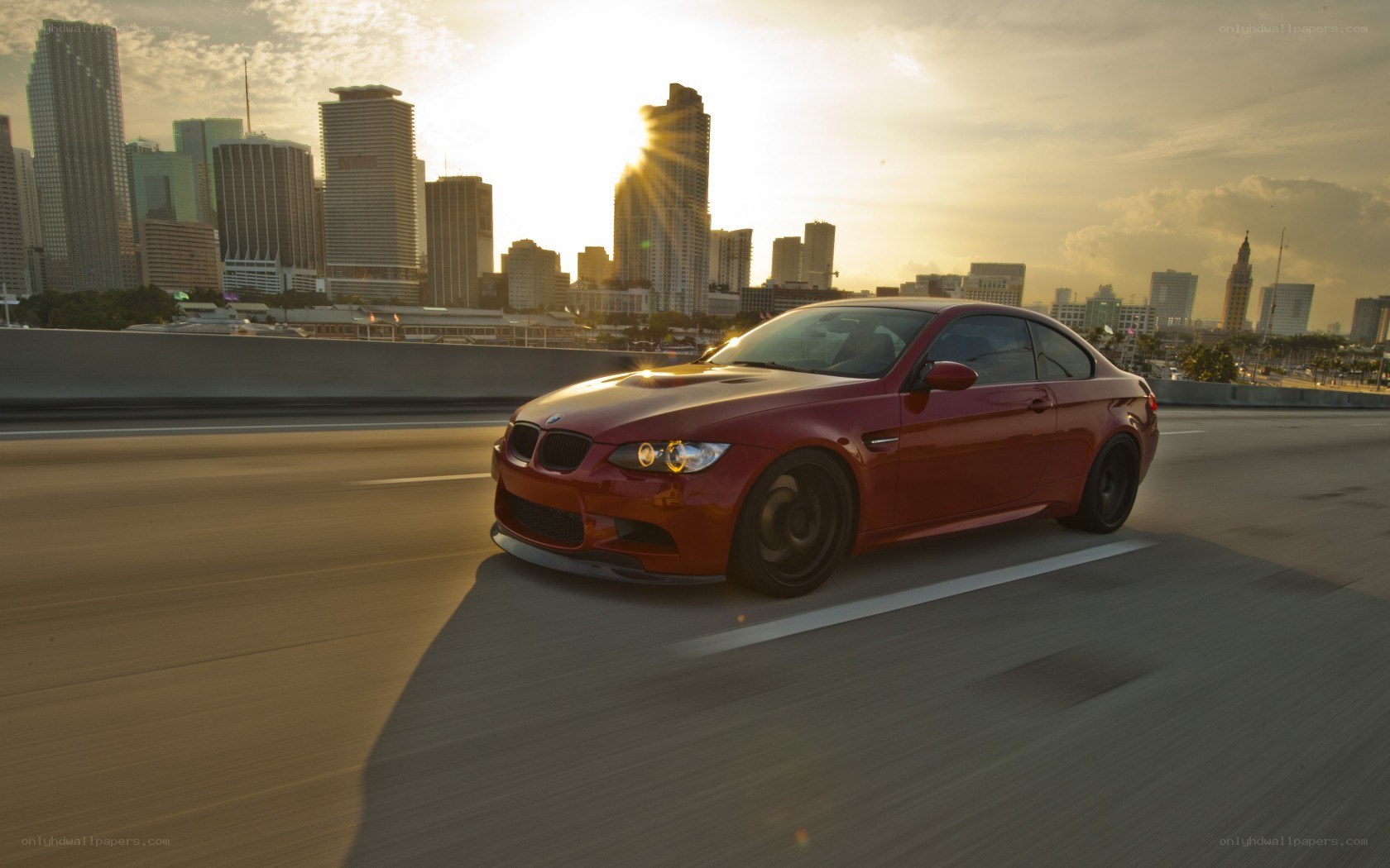 Red BMW driving on highway