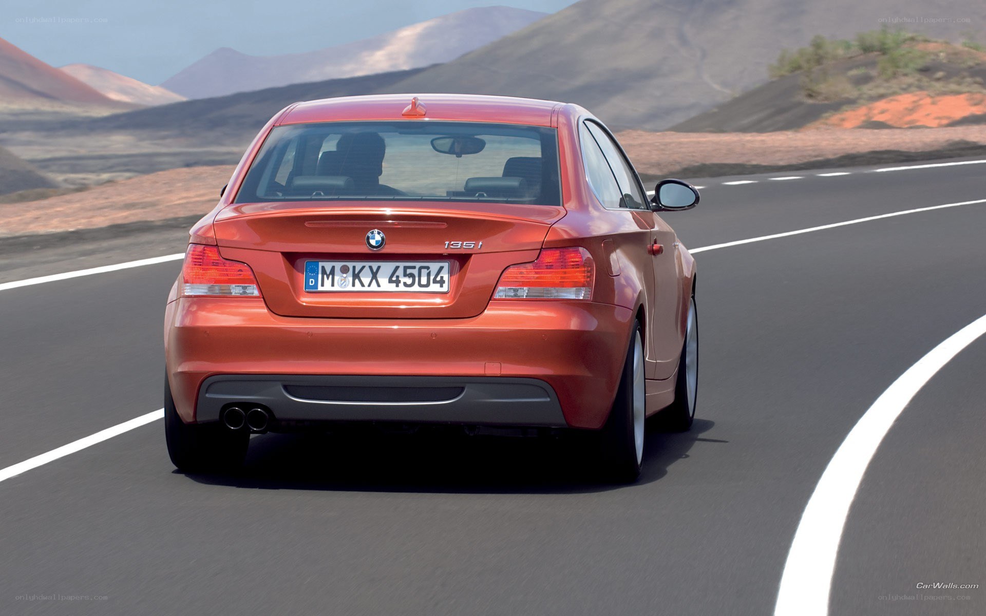 red bmw driving on road