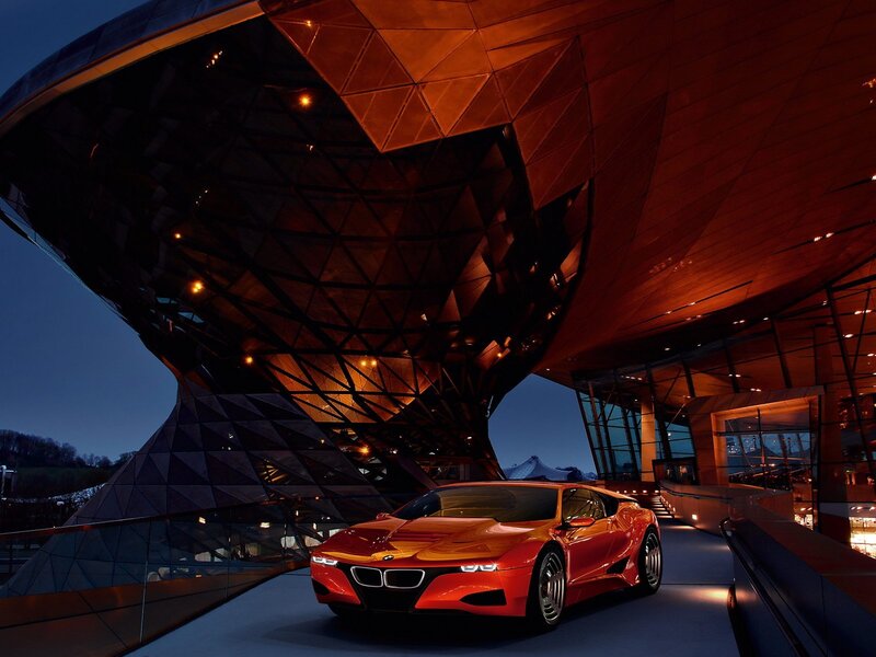 Red BMW i8 in front of modern building