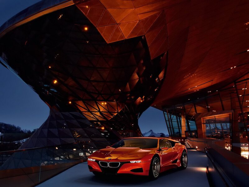 Red BMW i8 in front of museum