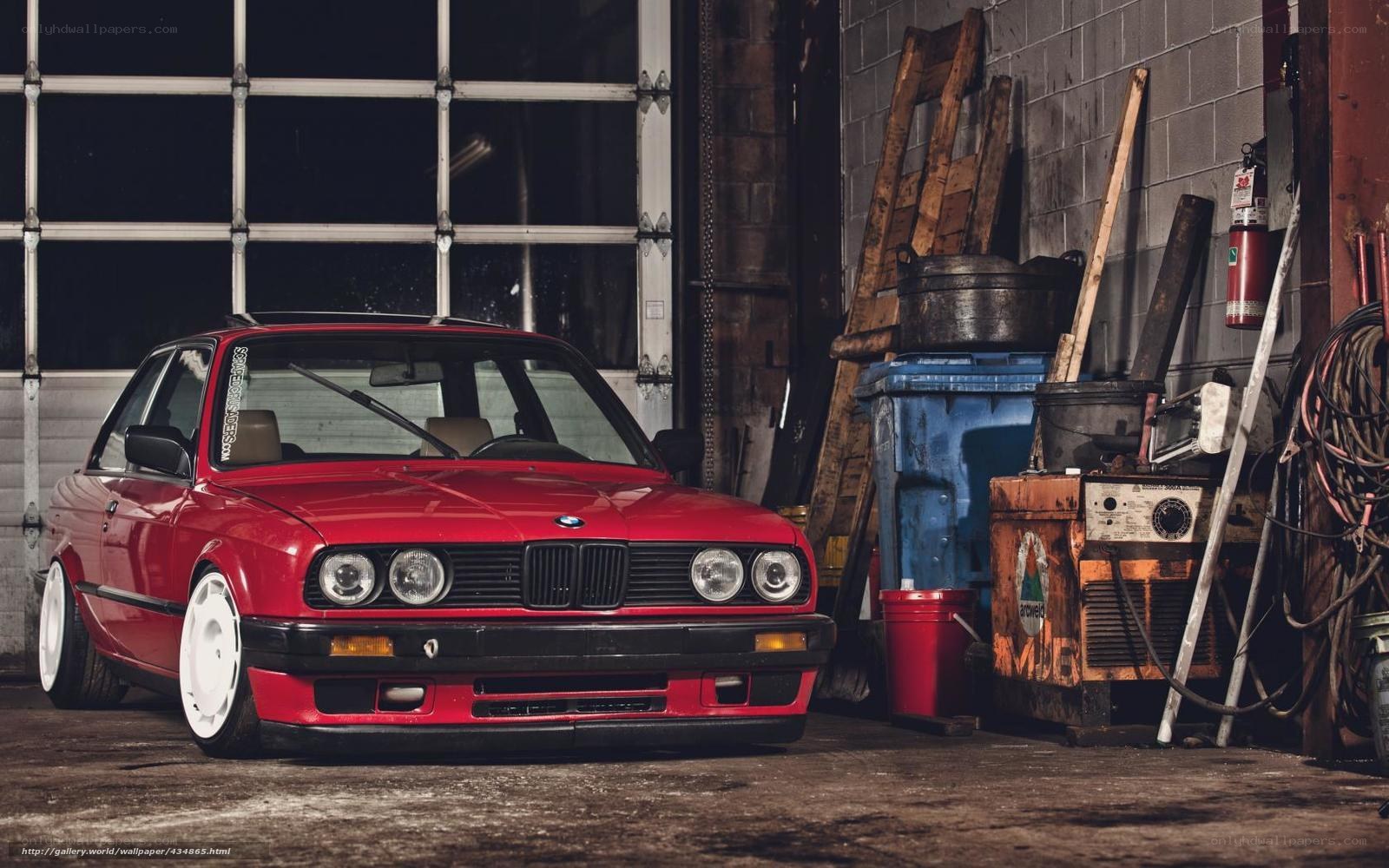 Red BMW in a garage