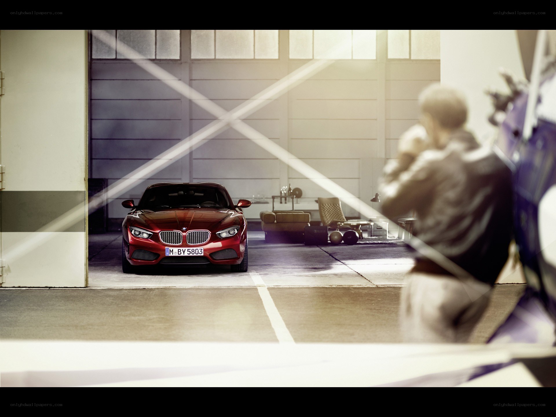 Red BMW in a garage