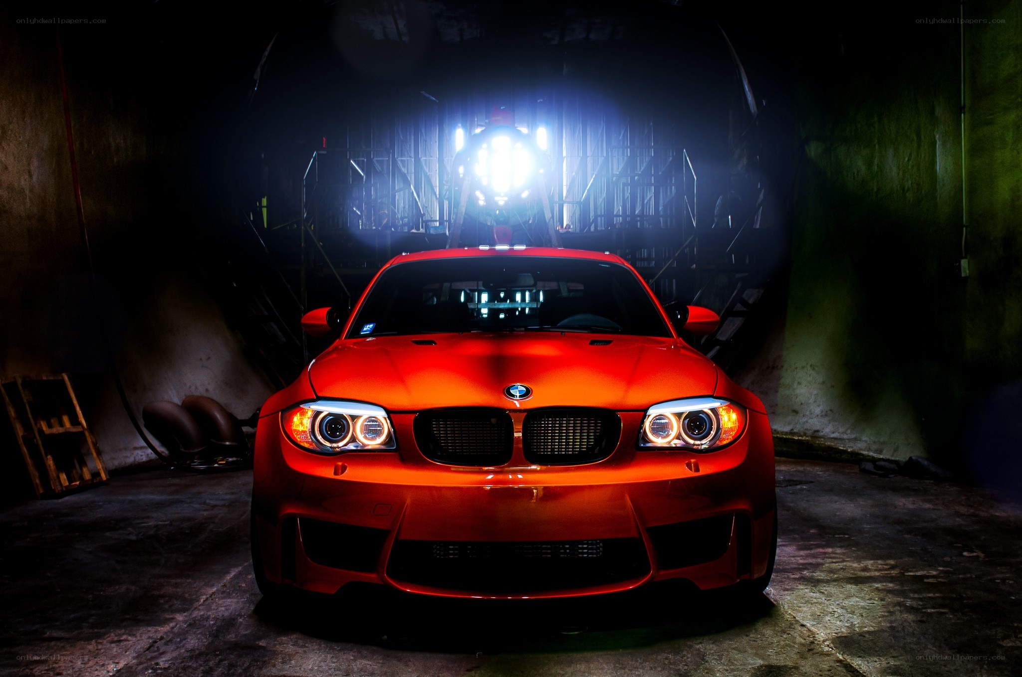 Red BMW in dark garage