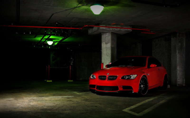 Red BMW in parking garage