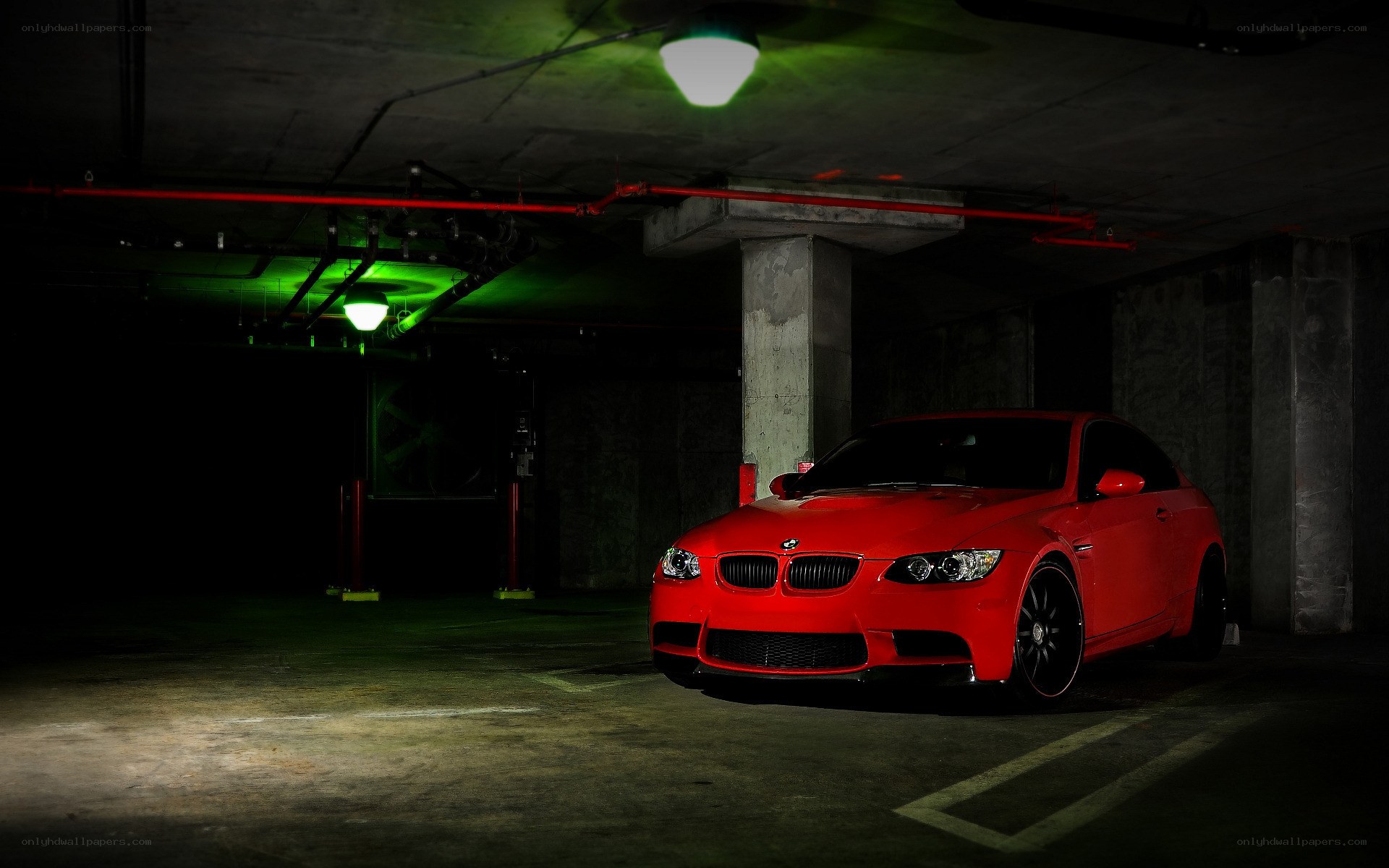 Red BMW in parking garage