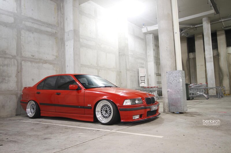 red bmw in parking garage