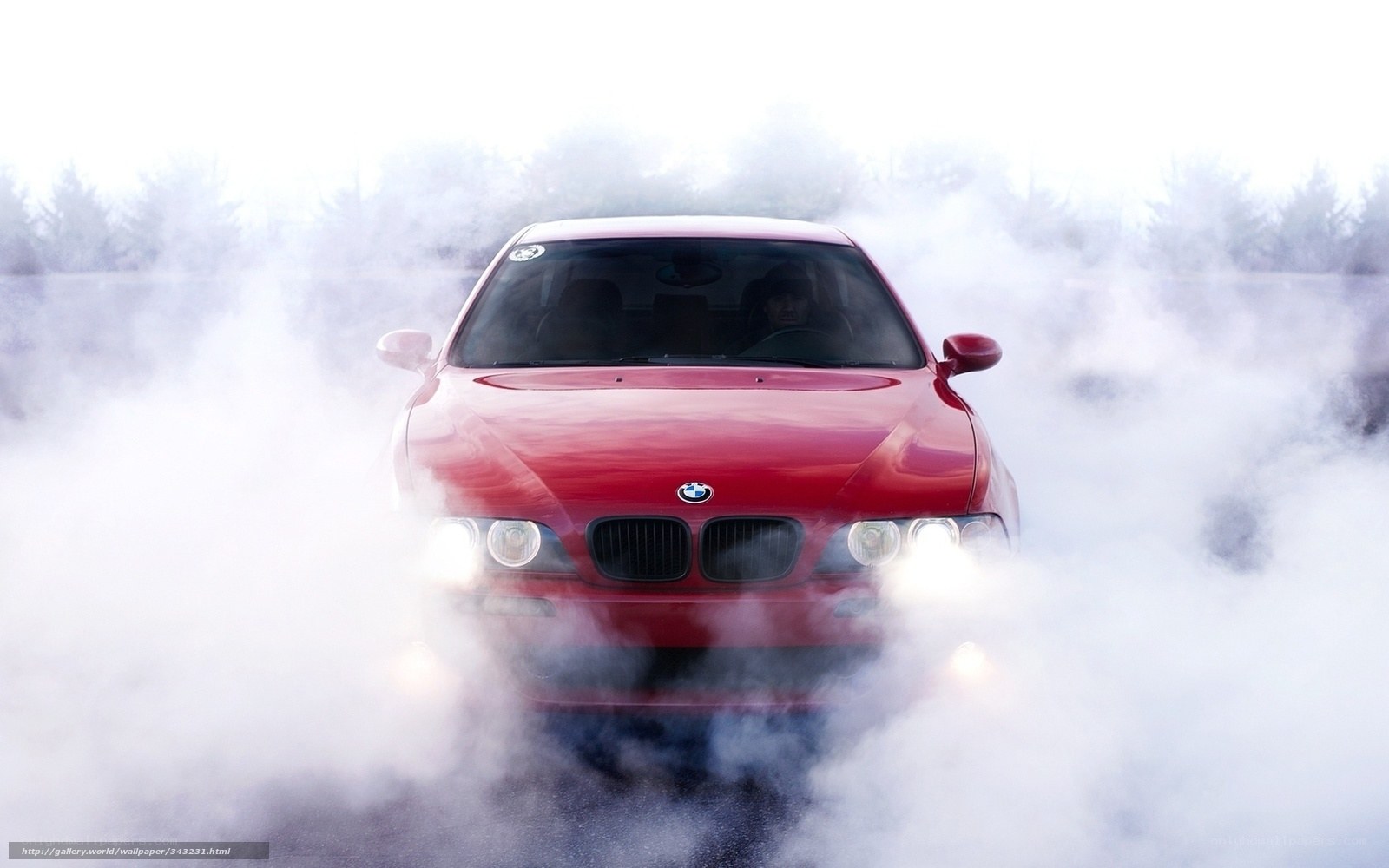 Red BMW in smoke