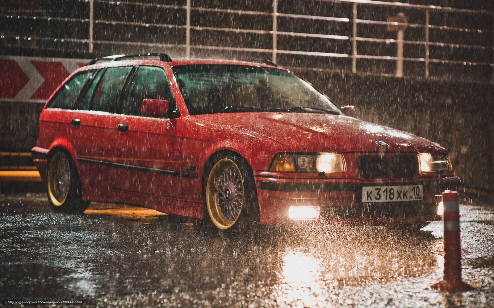 Red BMW in the rain