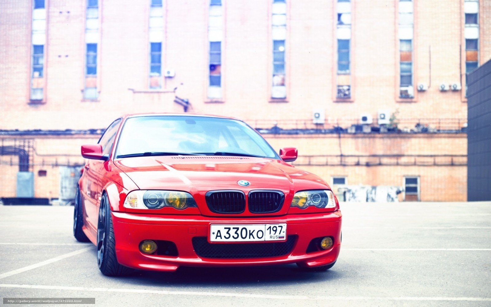 Red BMW in urban setting