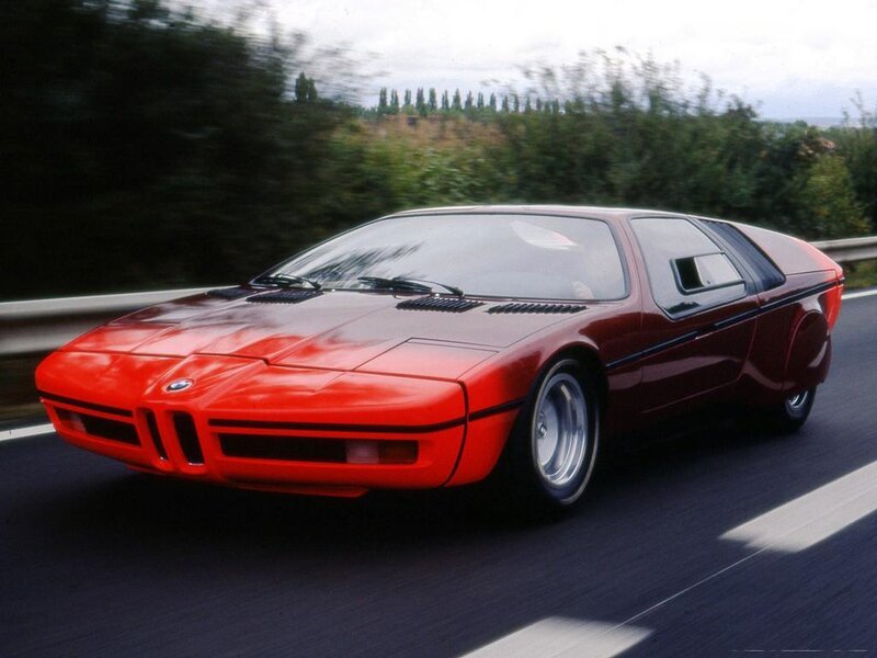Red BMW M1 on a highway