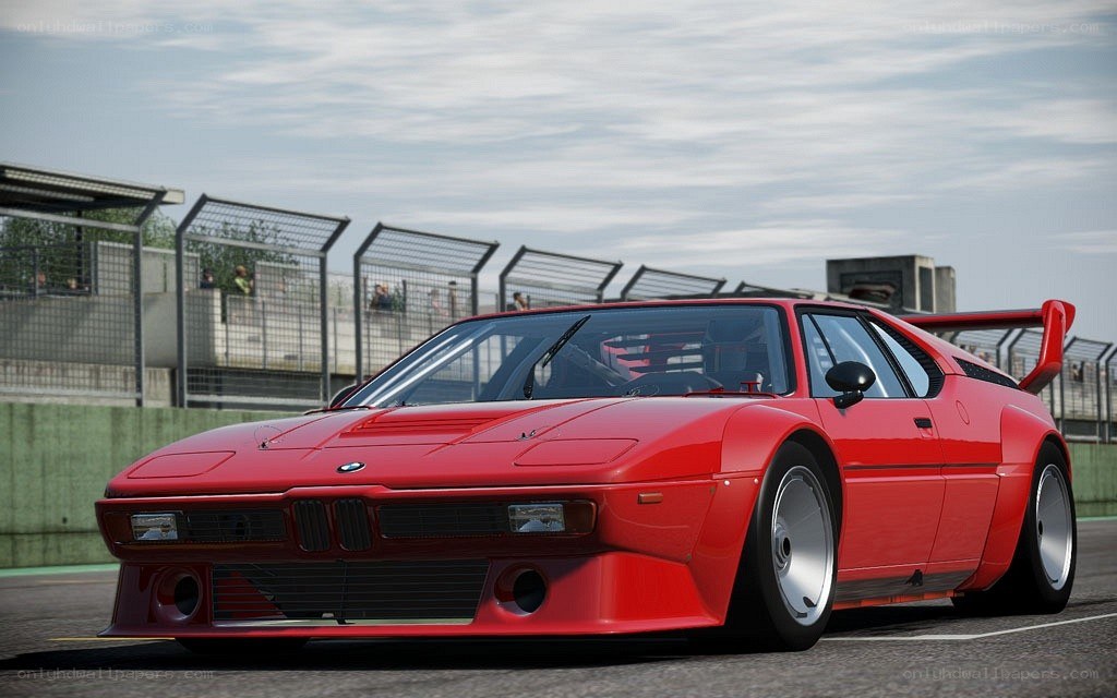 Red BMW M1 on a racetrack
