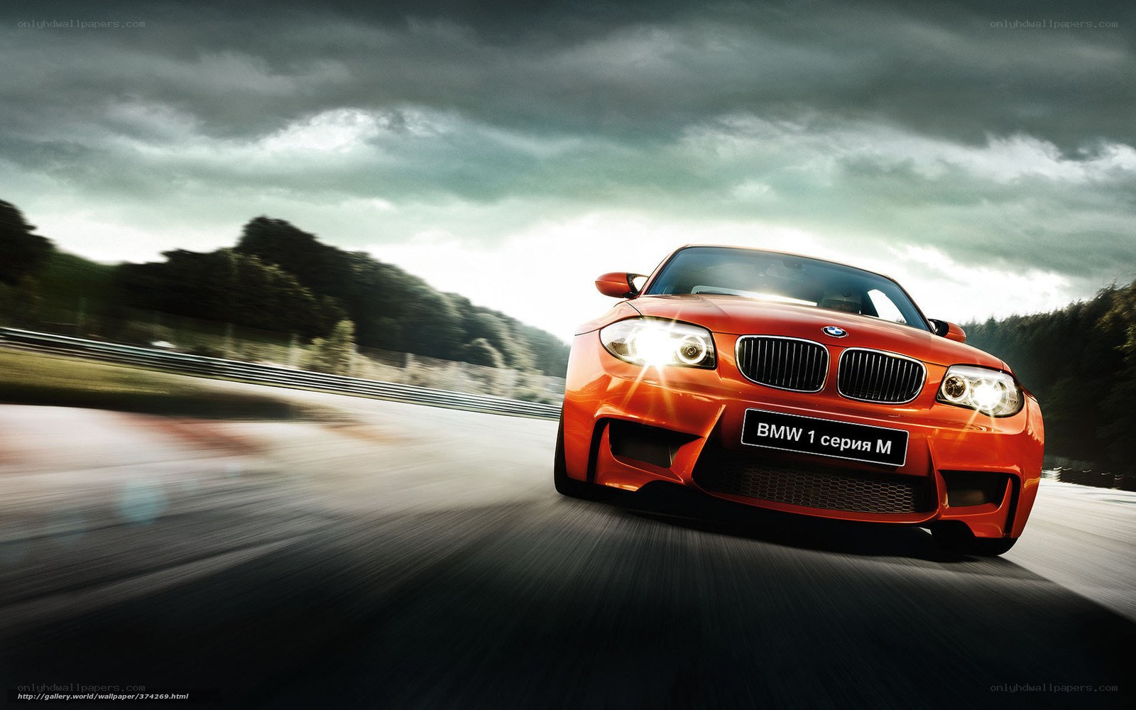 Red BMW M1 on racetrack