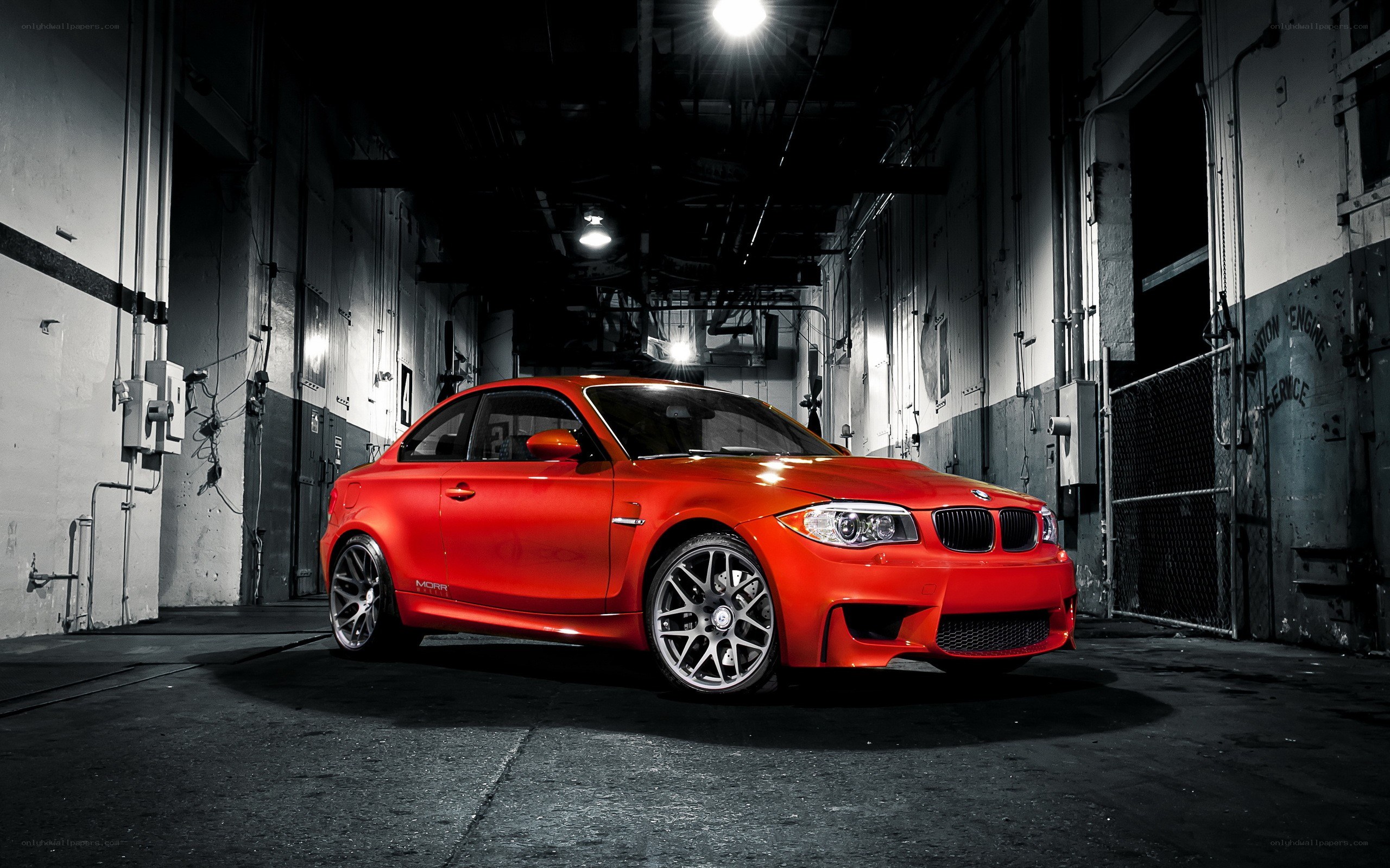 Red BMW M135i in warehouse