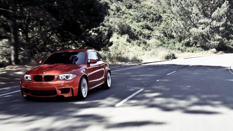 red bmw m135i on a winding road