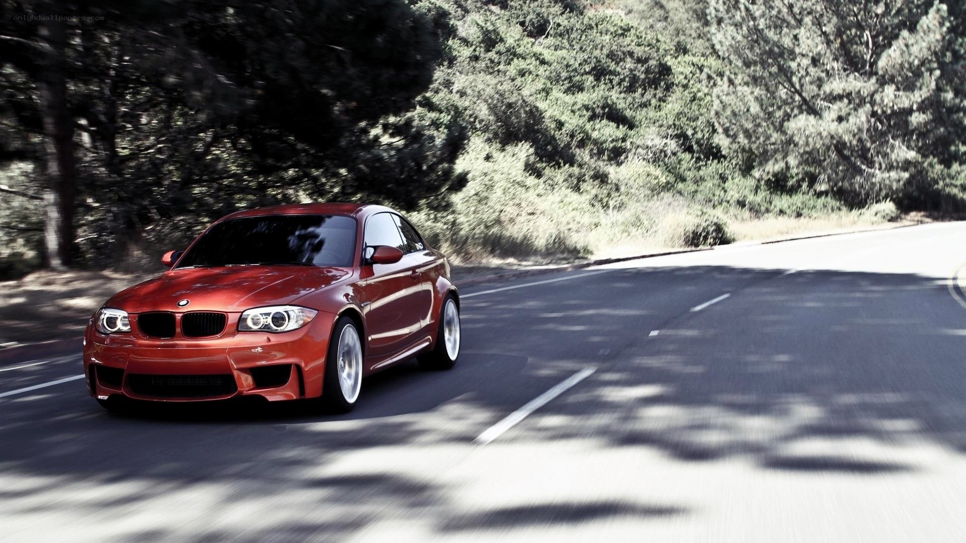 red bmw m135i on a winding road