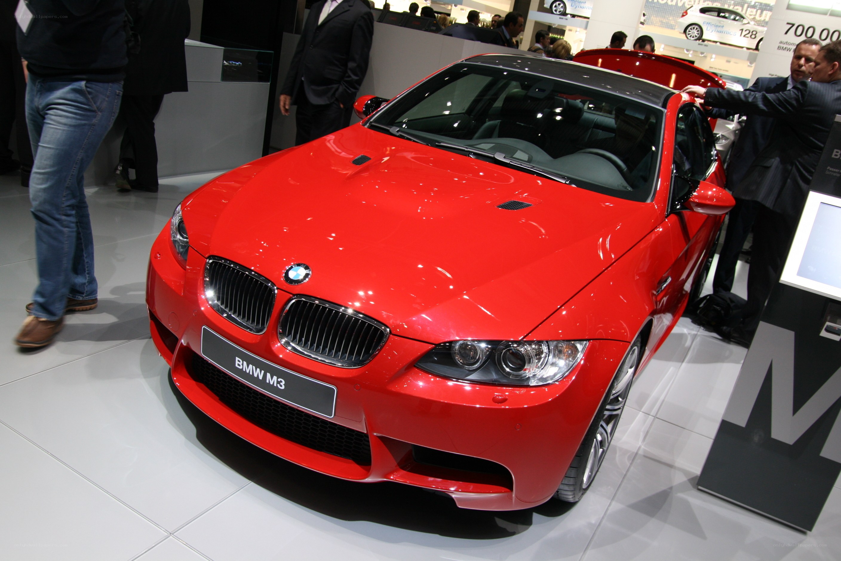 Red BMW M3 at auto show