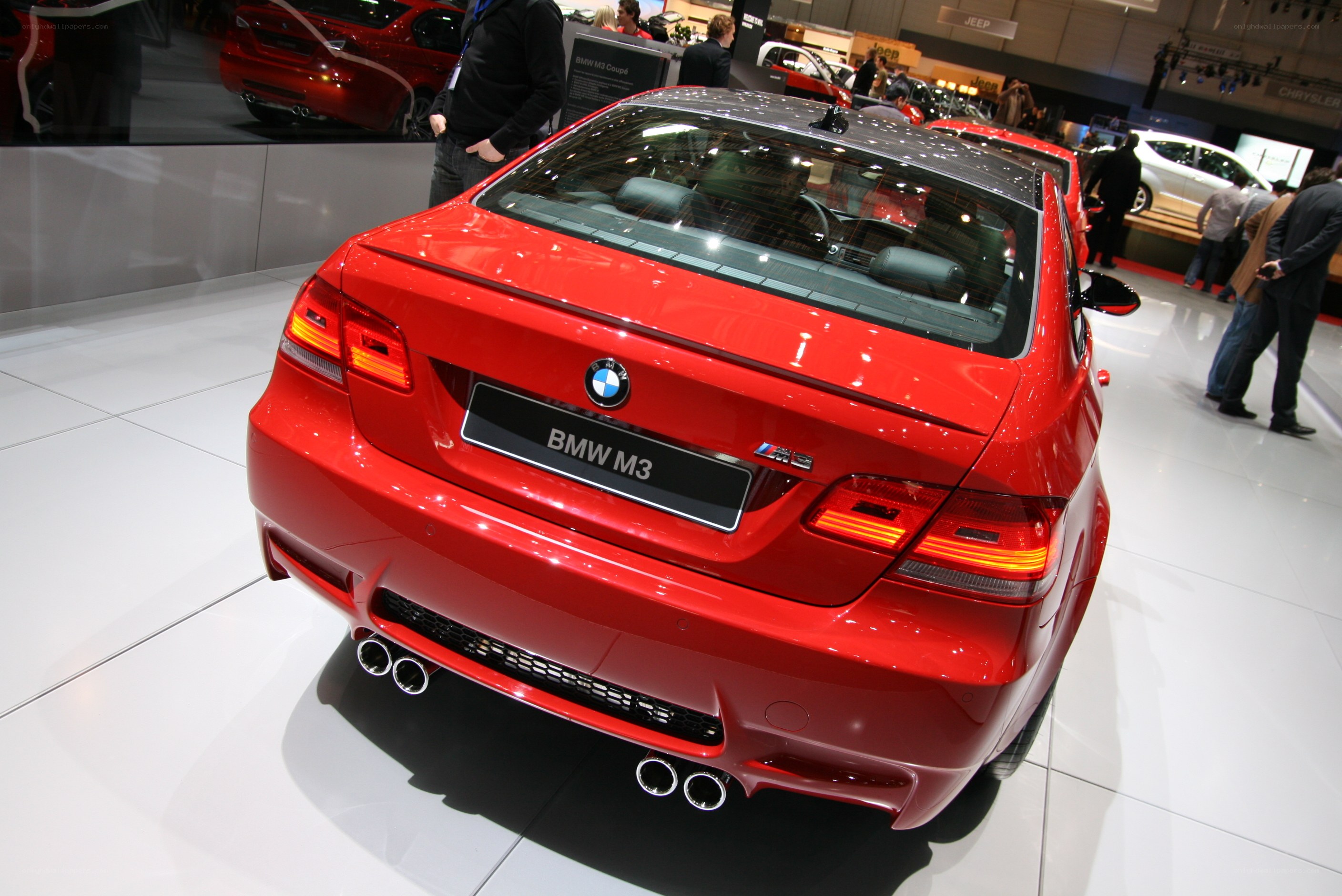 Red BMW M3 at auto show