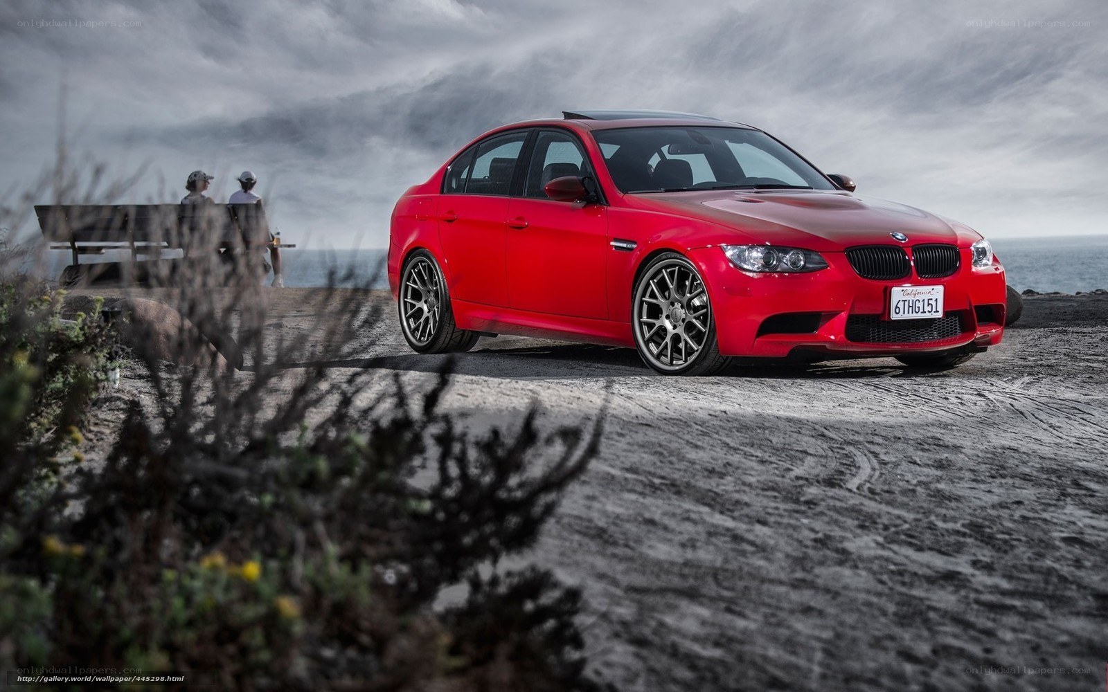 Red BMW M3 by the coast
