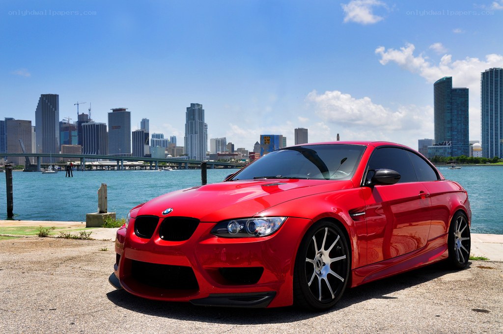 Red BMW M3 by the waterfront