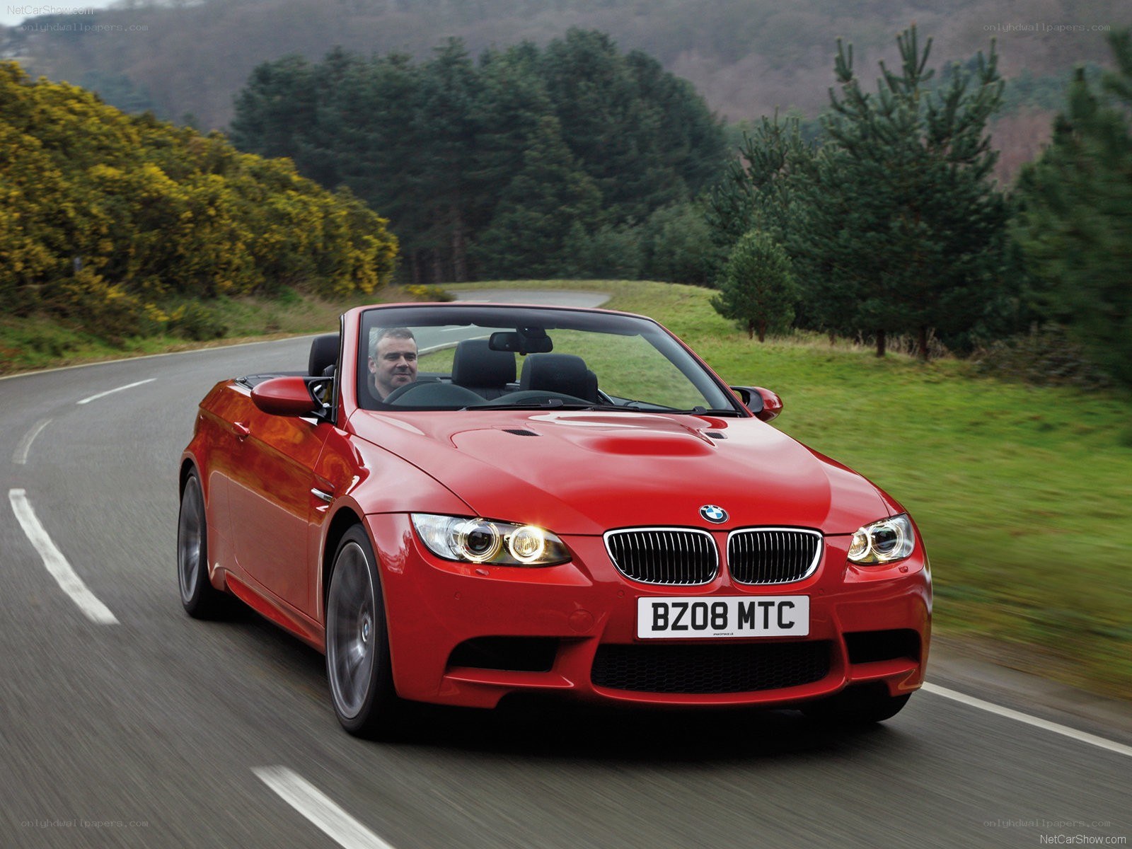 red bmw m3 convertible driving