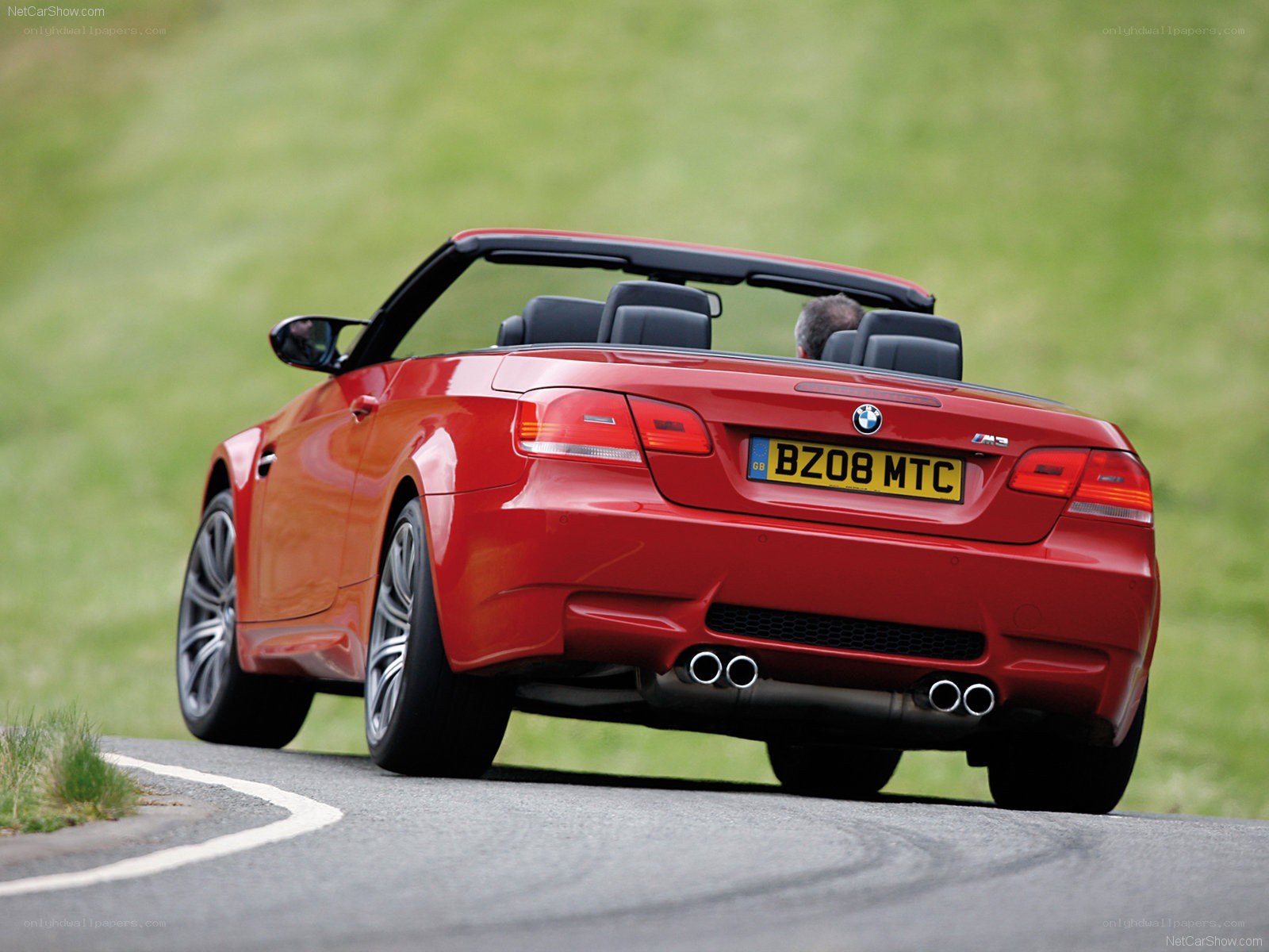red bmw m3 convertible driving
