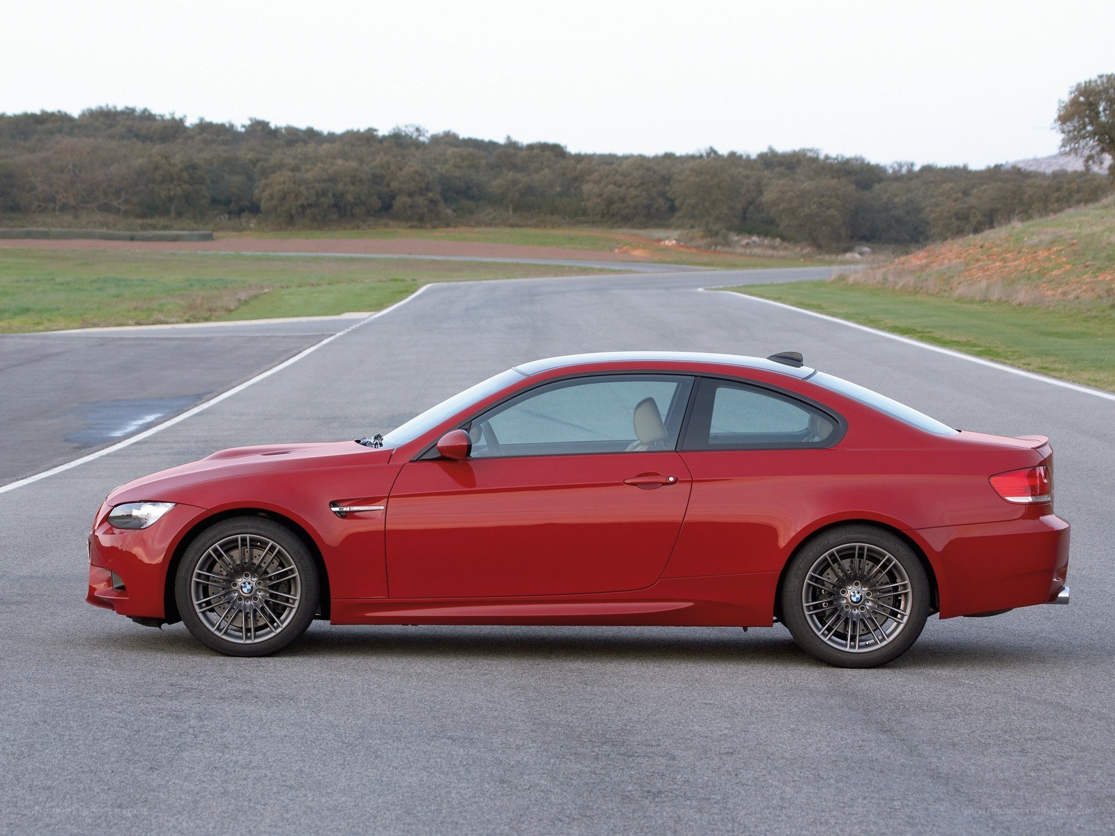 red bmw m3 coupe on track