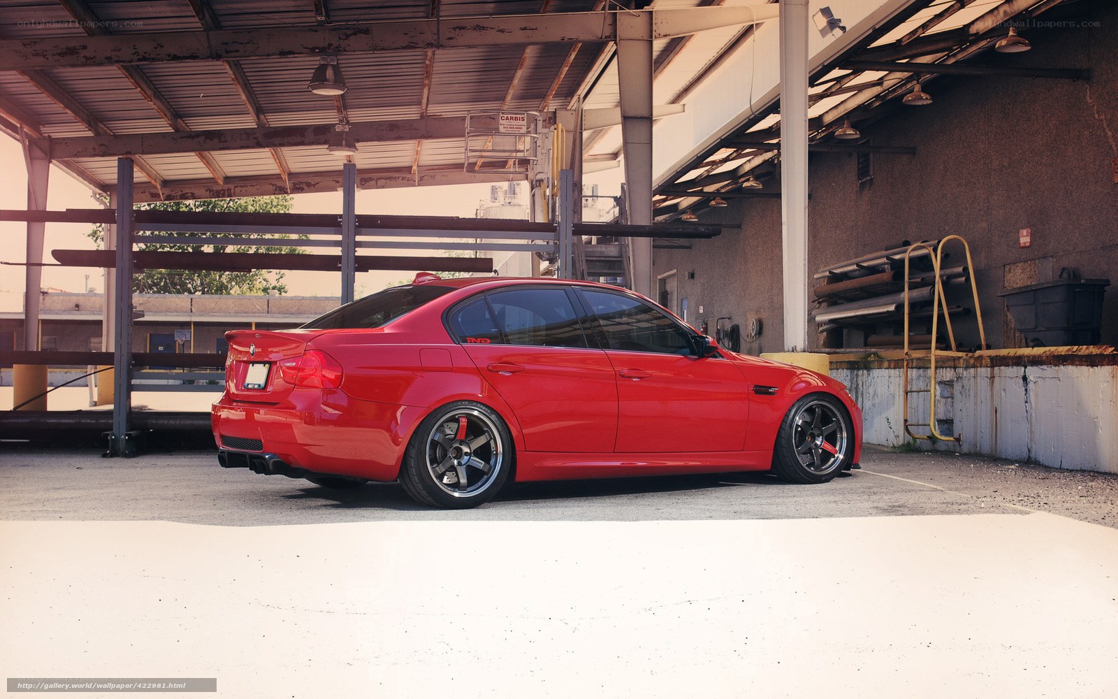 Red BMW M3 in a garage