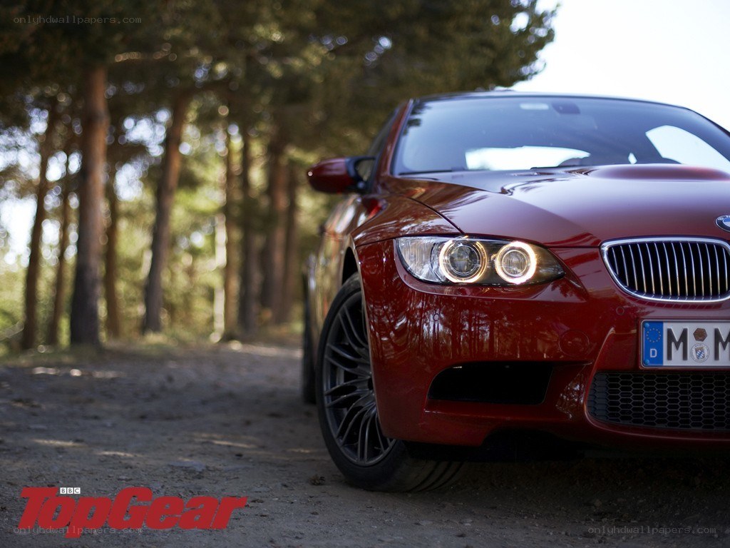 Red BMW M3 in forest