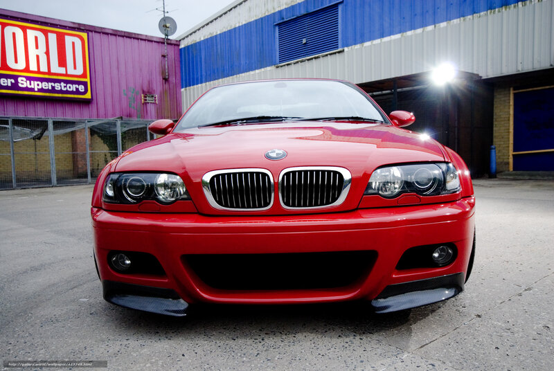 Red BMW M3 in front of superstore
