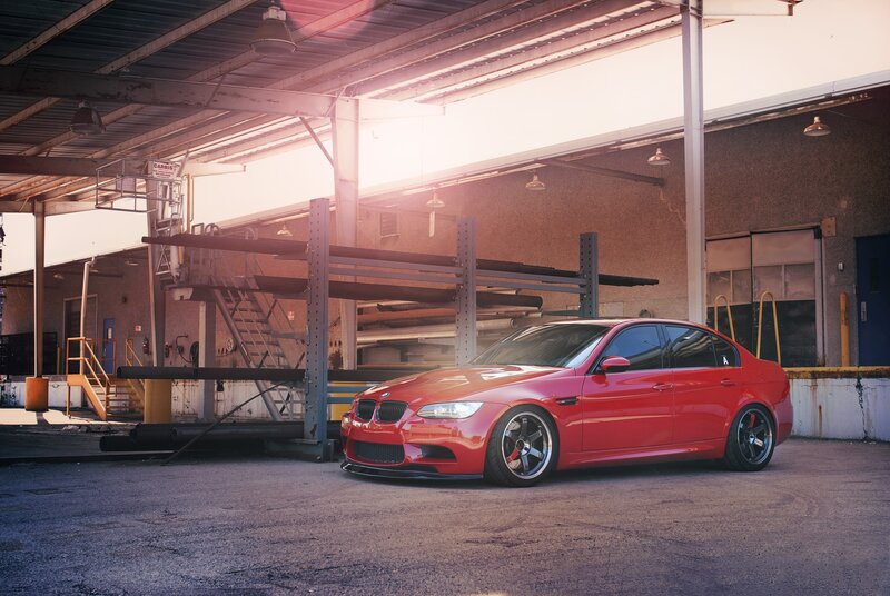 Red BMW M3 in industrial setting