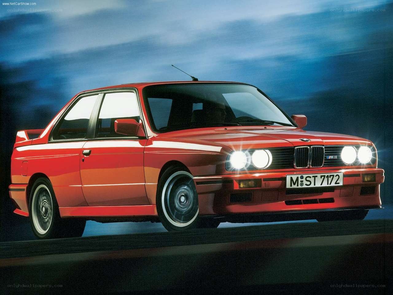 Red BMW M3 in motion