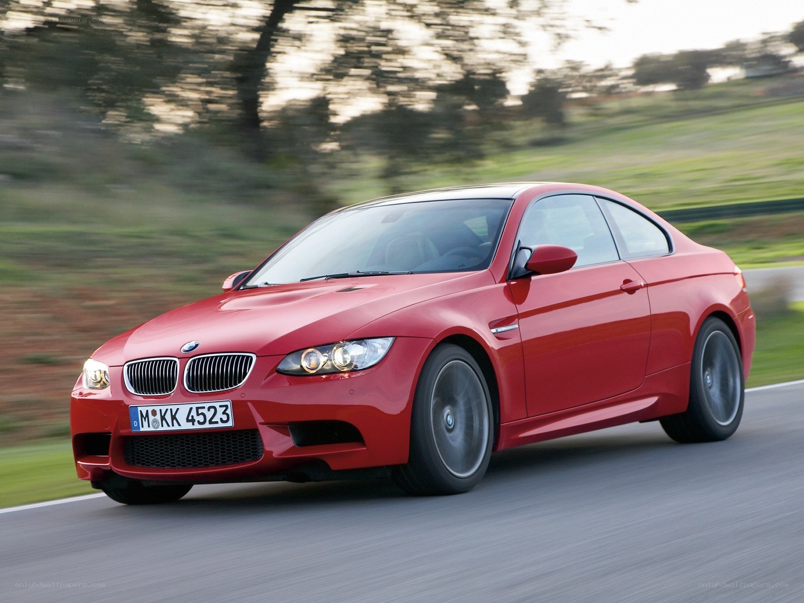 Red BMW M3 in motion