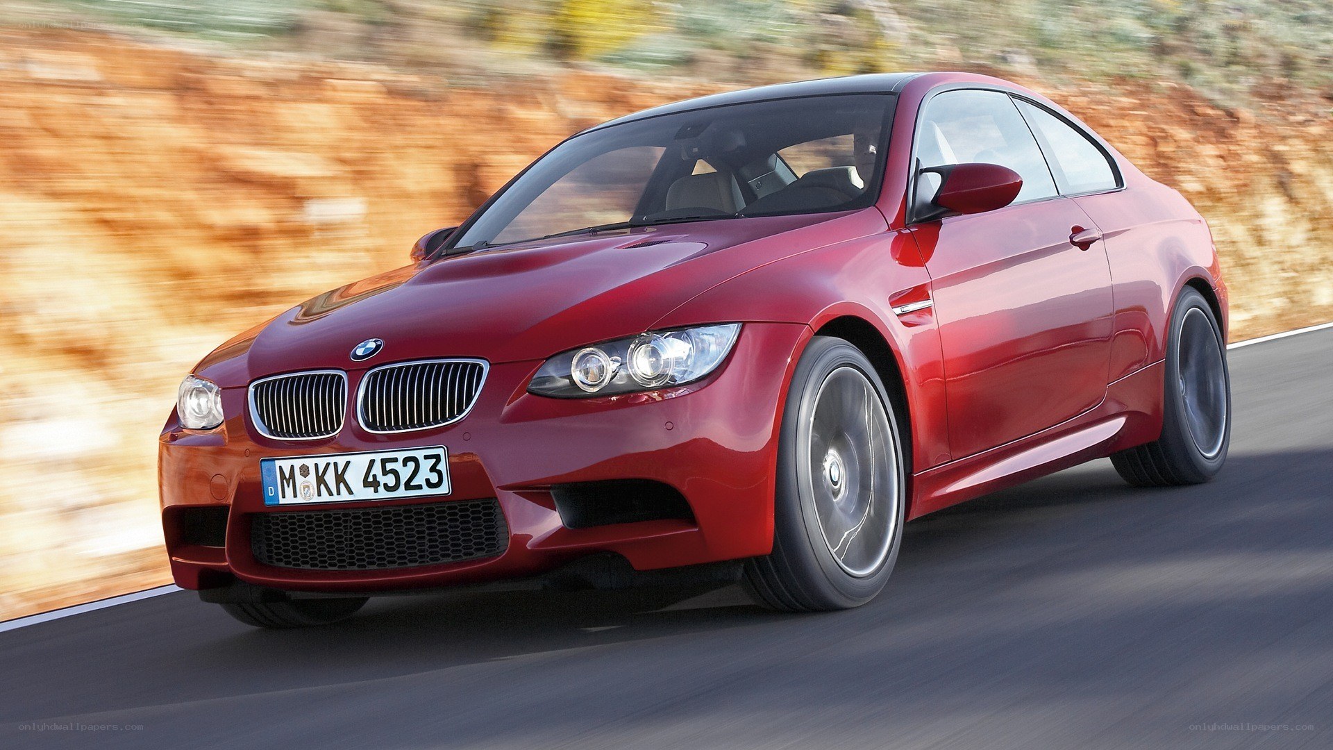 Red BMW M3 in motion