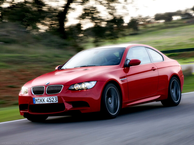 Red BMW M3 in motion