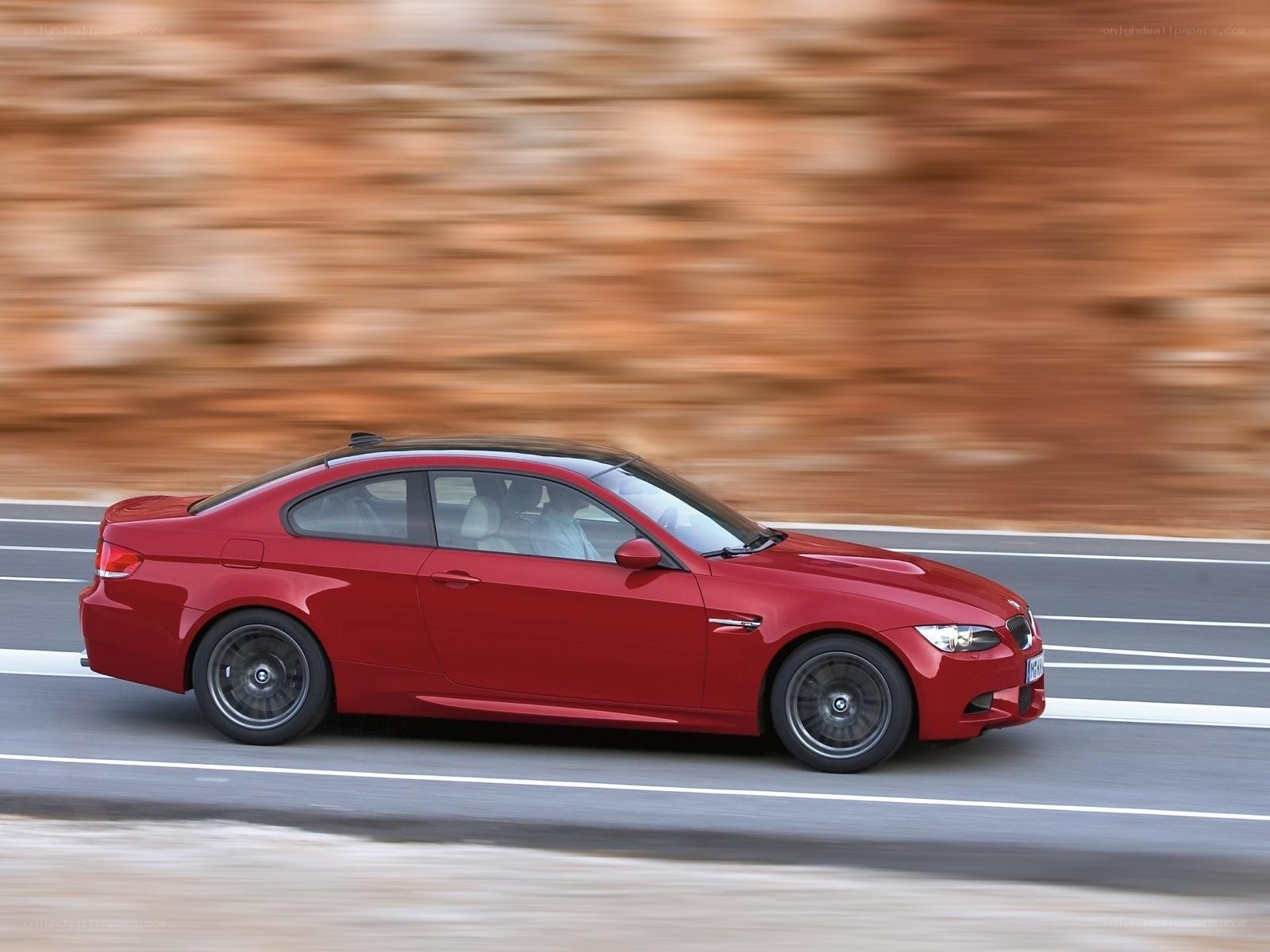 Red BMW M3 in motion