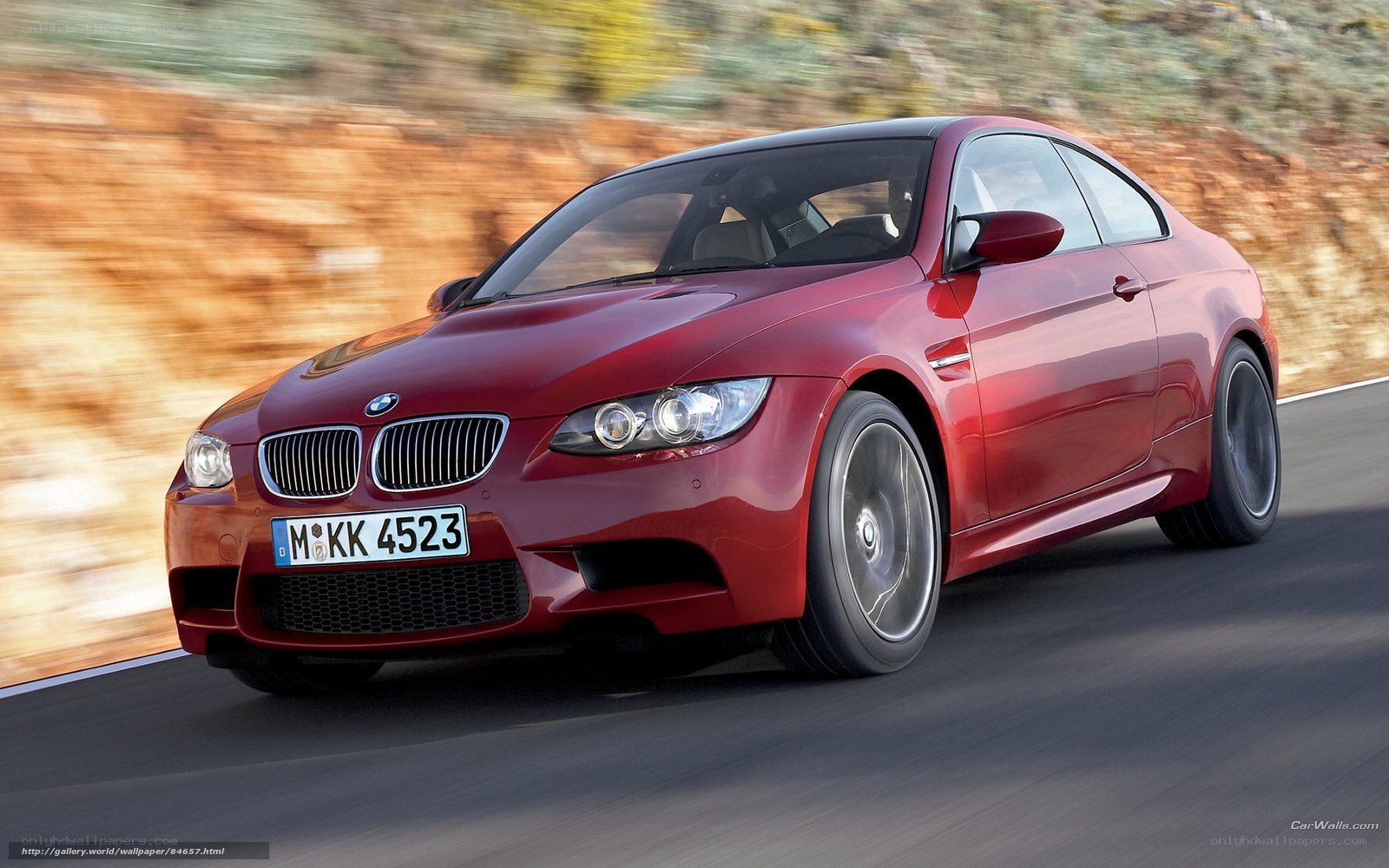 Red BMW M3 in motion