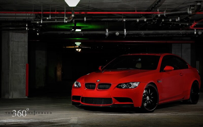Red BMW M3 in parking garage