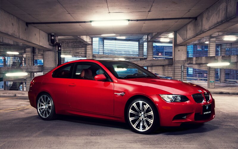 Red BMW M3 in parking garage