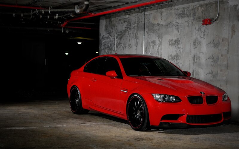 Red BMW M3 in parking garage