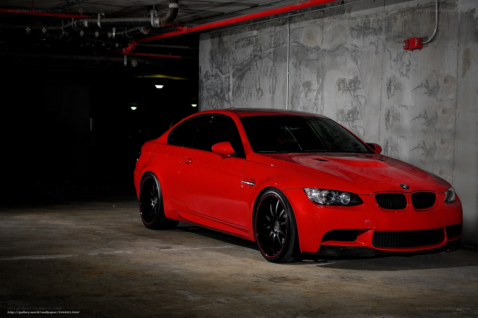 Red BMW M3 in parking garage