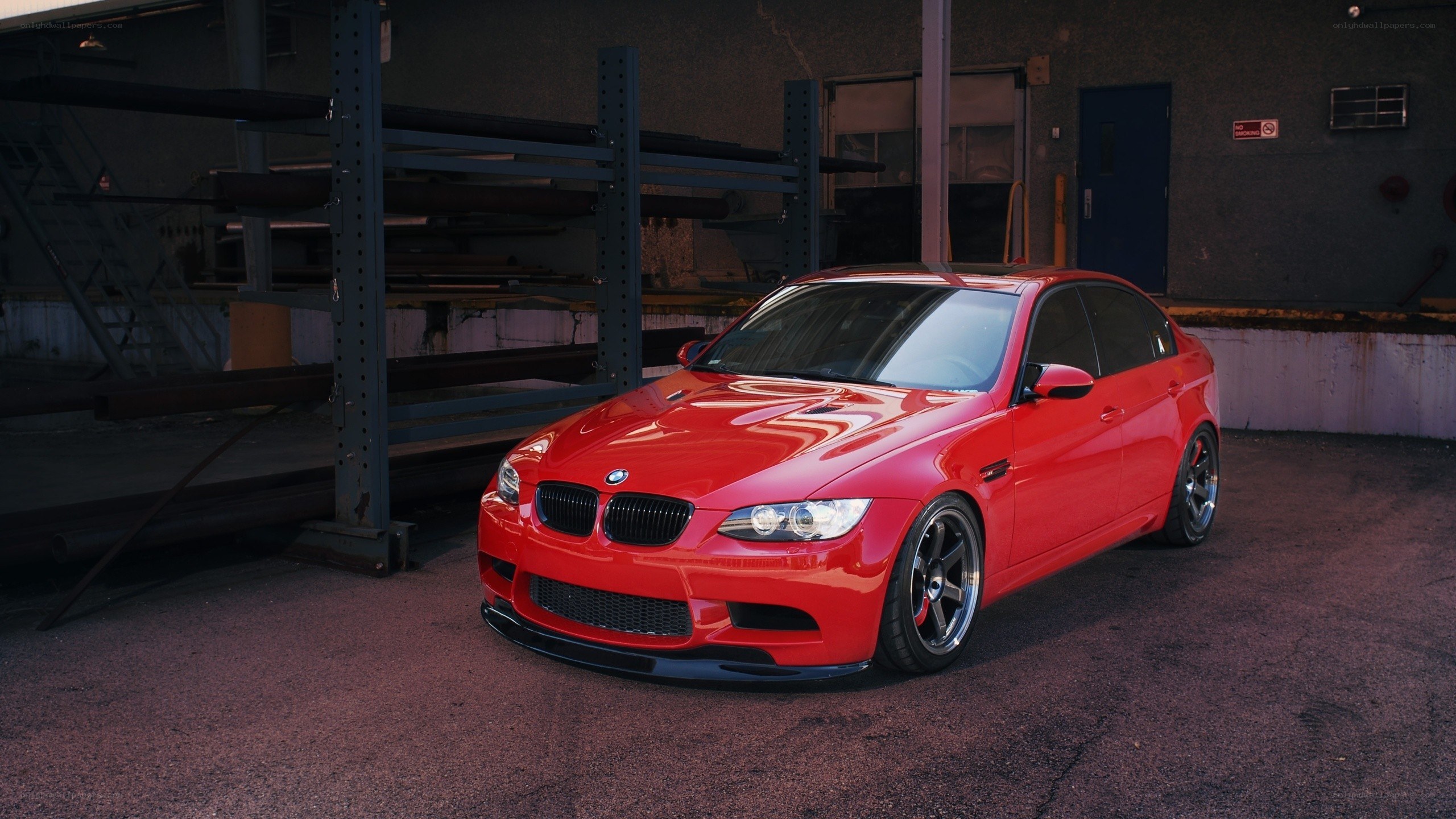 Red BMW M3 in warehouse