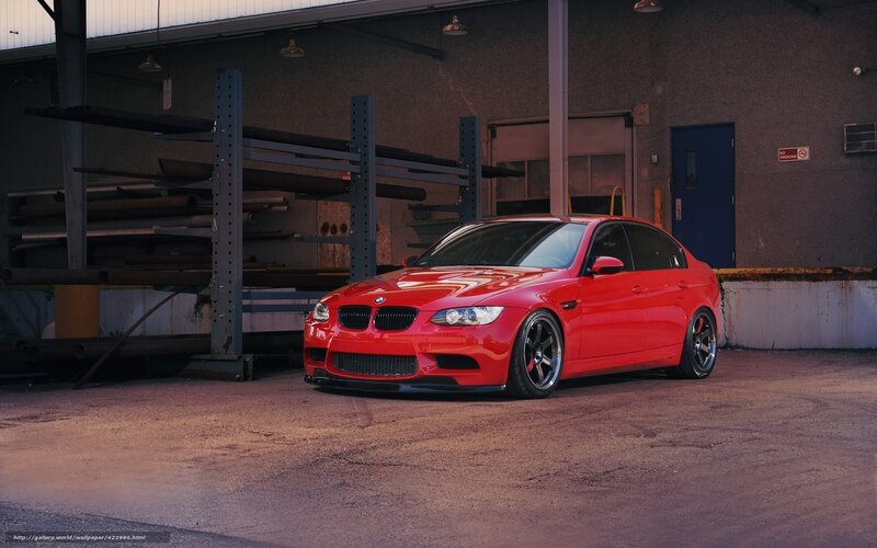 Red BMW M3 in warehouse
