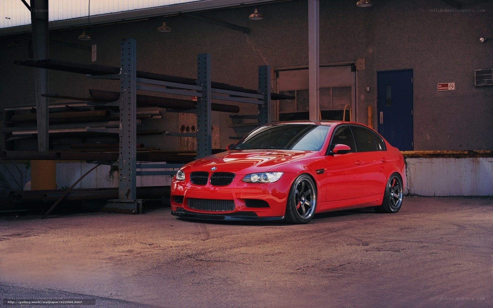 Red BMW M3 in warehouse