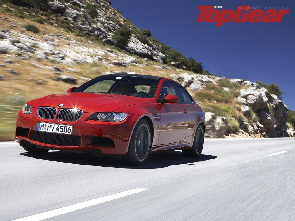 Red BMW M3 on a mountain road