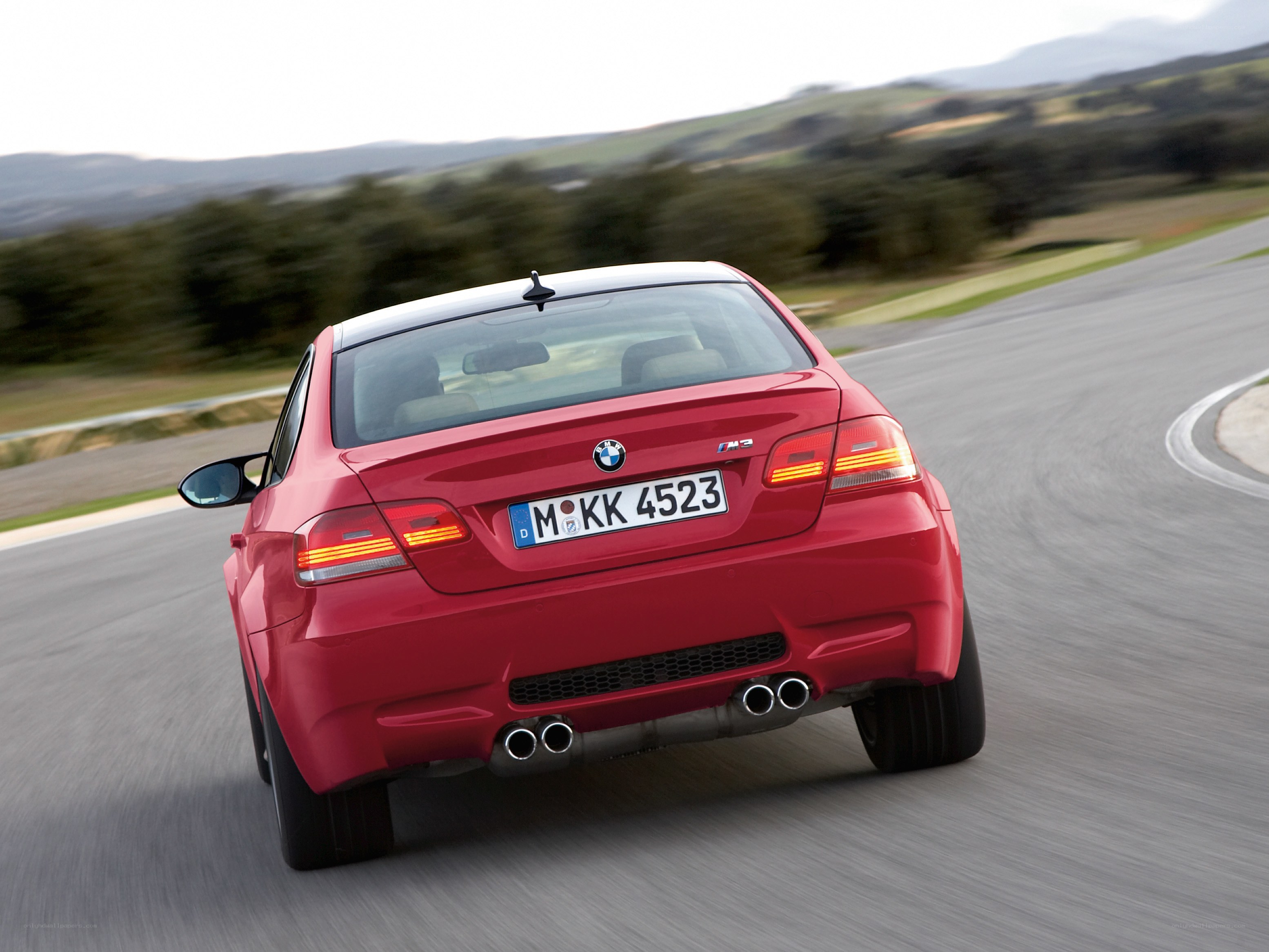 red bmw m3 on a racetrack
